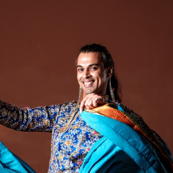 Swapnil Dagliya smiling in a blue Indian dance costume